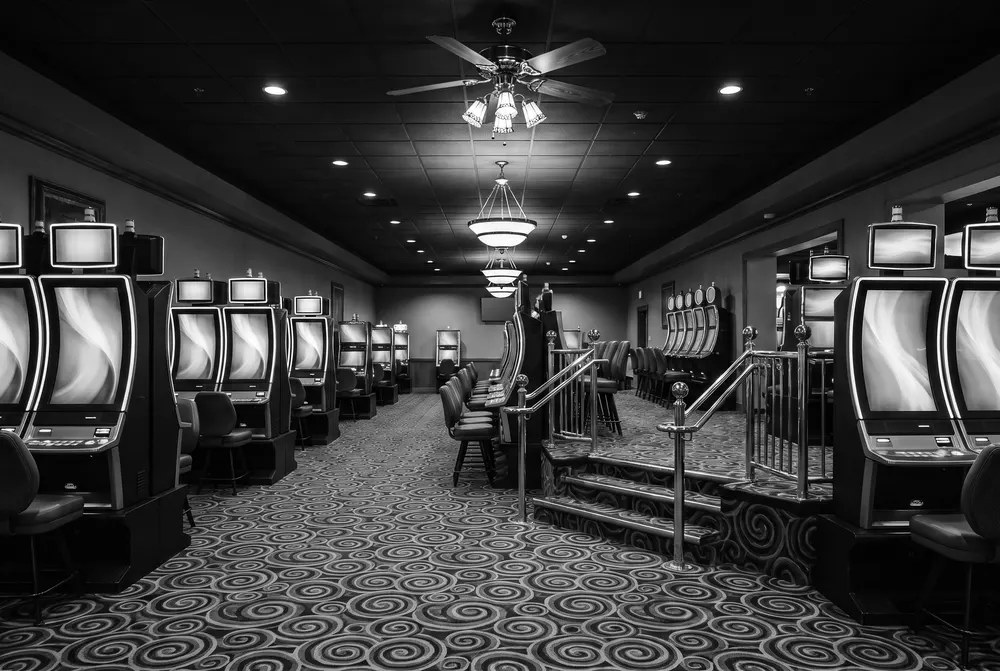 Slot rows and the railed landing at Gold Eagle Casino